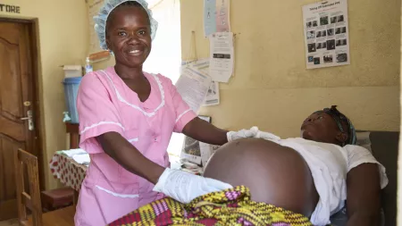Zainab, a nurse in Sierra Leone, performs a check-up on an expectant mother.