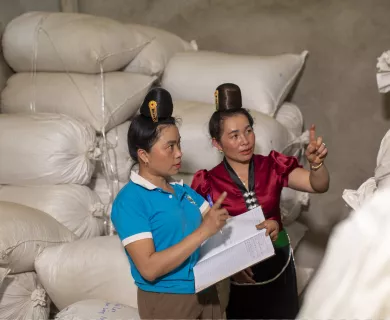 Members of the Ara Tay Coffee Cooperative inventory their coffee bean harvest at their facility in Vietnam