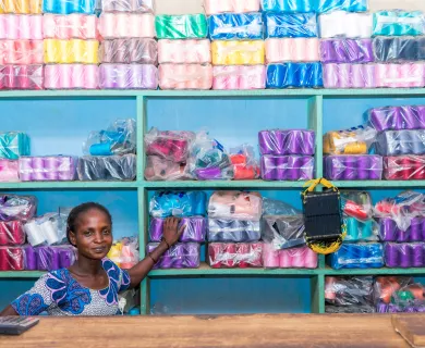 Kossiwa, a seamstress who has trained in weaving traditional fabrics known as pagne, at her shop